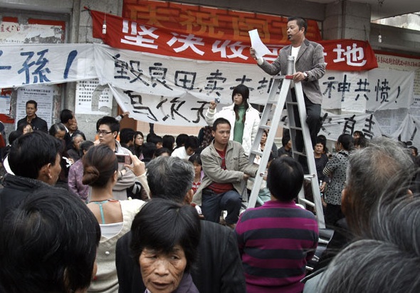 Xue Jinbo addressing a meeting in Wukan, China 