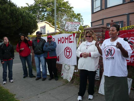 Tosha Alberta in front of her home